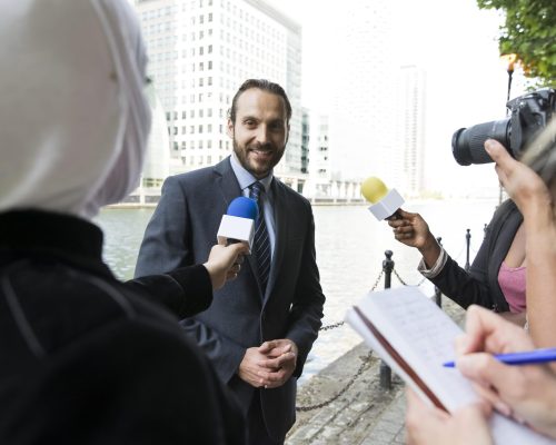 close-up-person-offering-interview