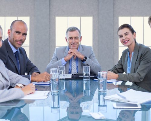 Portrait of confident business executives sitting in a conference room